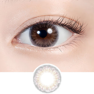 Close-up beauty shot of Lilmoon Monthly Flamingo colored contact lenses on brown eyes. Pink and gray monthly circle lenses blend a soft blush center with a smoky outer halo for a dreamy, natural eye enhancement. Available in prescription and non-prescription options, perfect for clean girl makeup, romantic looks, and everyday wear.