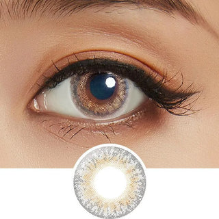 Close-up shot of model's eye adorned with Lilmoon Monthly Cream Grege (Non Prescription) color contact lenses prescription, paired with clean-girl eye makeup, showing the brightening and enlarging effect of the circle contact lens on dark brown eyes, above a cutout of the contact lens with limbal ring on a white background.