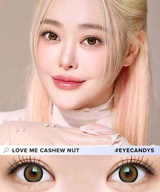 A woman with long, light blonde hair and flawless makeup gazes at the camera, her hazel eyes enhanced by i-Sha Dekame Love Me Cashewnut Brown contacts from i-Sha. Text reads: "LOVE ME CASHEW NUT #EYECANDYS.