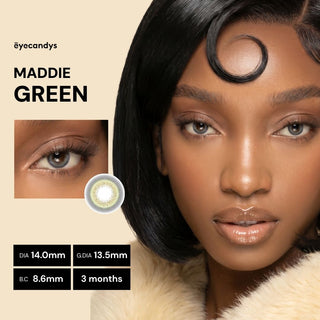 Close-up of a woman with smooth skin and shiny black hair styled with a curl on her forehead, wearing EyeCandys Pink Label Maddie Green color contacts. Inset shows her eye and lens details: DIA 14.0mm, G.DIA 13.5mm, B.C 8.6mm, 3-months use.