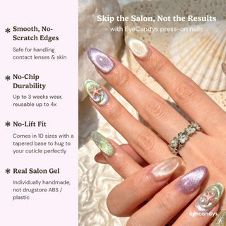 Close up hand showcasing EyeCandys Mermaid on Duty press on nails with multicolor cat eye nails, holographic shimmer, and starfish accents.