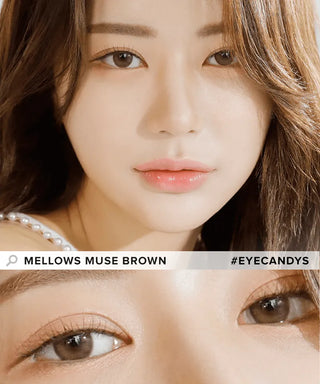 A woman with natural makeup wears Olola Mellows 1-Day Muse Brown (10pk) lenses by Olola. The image shows a close-up of her face and a zoomed detail of her eyes. Text reads "Olola Mellows Muse Brown" and "#EYECANDYS.