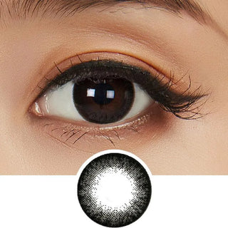 Close-up of a person's brown eye with long lashes wearing NEO Vision Extra Dali Black circle lenses, which enlarge the iris. Below is a circular image highlighting the cosmetic contact lens design from NEO Vision.