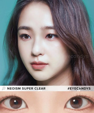 A young woman with long, wavy dark hair and fair skin gazes forward. A close-up shows her brown eyes with NEO Vision Neoism Super Clear (50pk) contacts. Text: "NEO VISION NEOISM SUPER CLEAR #EYECANDYS.