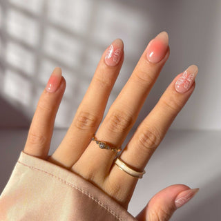  Hand showing off EyeCandys Flutter Gel Nail Stickers – easy 10-minute spring nails with a 7-free, allergy-friendly formula. Salon-quality look that lasts 2–3 weeks, cures in sunlight, and strengthens natural nails. Perfect for minimalist or trendy spring nail designs without a UV lamp.