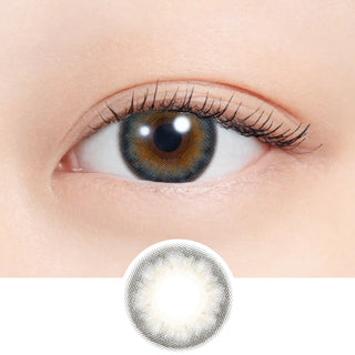 Close-up of eye wearing EyeCandys N's Collection Lassie Neo Grey (10pk) prescription colored contact lens with lens design shown below, silver grey three-tone gradient with green shimmer and defined limbal ring, Korean daily disposable colored contacts for dark eyes