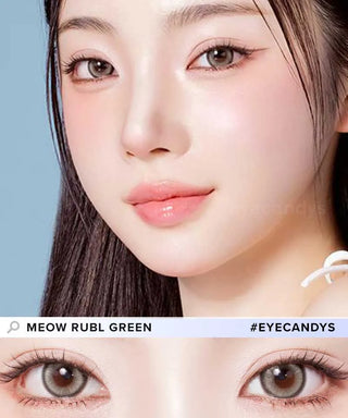 Close-up of a woman with fair skin, pink lips, and straight dark hair wearing natural makeup. Below is a detailed view of her hazel-green Olola Meow Vivid Rubl Green prescription colored contacts by Olola. Text: "MEOW RUBL GREEN #EYECANDYS.