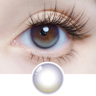 Close-up of an eye with long lashes wearing Olola Vela Purple prescription colored contact lens, showing the lens design below.