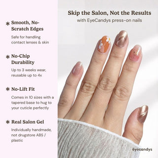 Close up hand showcasing Peachy Keen press on nails with floral daisy design, jelly finish, rose gold metallic nail, and mauve shimmer accent.