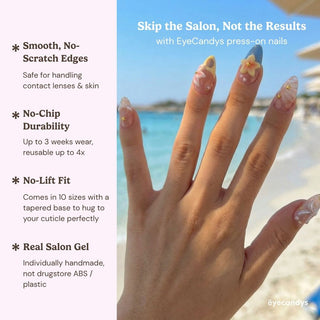 Stylish hand wearing Eyecandys Shell Yeah press on nails featuring almond shape, ocean inspired 3D shell details, and pearl accents.