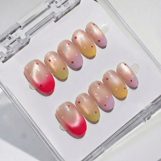 Short oval press on nails Sorbet Season with vibrant multicolor ombre blend and playful confetti dot nail art.