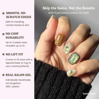 Close-up hand wearing EyeCandys Sun Spell press on nails in nude, amber, and green shades.