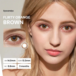 Model wearing Pink Label Flirty Orange Brown colored contact lenses with warm orange-brown eye enhancement