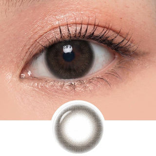 A close-up of an eye wearing EyeCandys Pink Label Marshmallow Grey contacts, with a separate image below showing the lens’s design—a soft grey tint and patterned edge—for those seeking natural-looking grey contacts.
