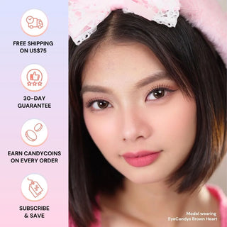 Close-up of a woman with straight black hair and pink headband, wearing natural makeup. Text on the left lists benefits. Bottom text reads: "Model wearing EyeCandys Brown Heart contact lenses by EyeCandys.