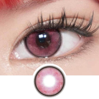 A close-up of an eye with long lashes wearing EyeCandys Powerglow Reddish Pink color contact lens. Below, a separate image shows a single pink UV protection lens from EyeCandys.