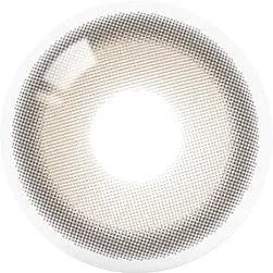 A close-up top view of Olola Purity Shine 1-Day Hazel Brown contact lens by Olola, featuring a bright central area and a subtle mesh-like pattern, similar to an audio grill’s perforated design.