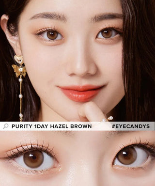 A woman with long dark hair wears Olola Purity Shine 1-Day Hazel Brown (10pk) myopia lenses by Olola, smiling softly. Her makeup is natural with peach lips and dangling gold earrings. A close-up shows her stunning hazel brown eyes.