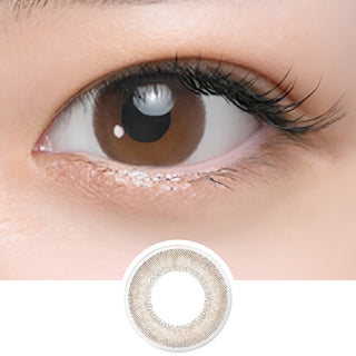 Close-up of eye wearing EyeCandys Seed Coffret First Make Brown (10pk) prescription colored contact lens with lens design shown below, warm brown dual-tone gradient with soft natural finish, Japanese daily disposable colored contacts for realistic everyday eye enhancement