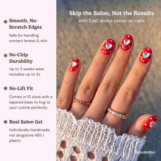 A hand displays EyeCandys Spot the Difference Press-On Nails—red with white polka dots and silver hearts—against a blurred outdoor background. Text notes their durability and salon-quality gel manicure results.