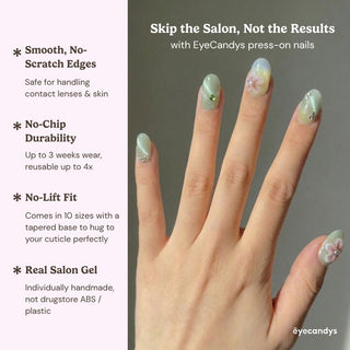 Stylish hand wearing EyeCandys Spring Fling press on nails featuring pastel green gradient, floral 3D blossoms, and crystal detailing.