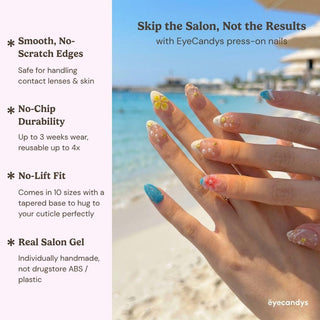 A hand with vibrant Tahiti Feeling Press-On Nails by EyeCandys is held against a tropical beach, showcasing smooth edges, no-chip durability, no-lift fit, and real salon gel quality for a flawless Salon Gel Manicure.
