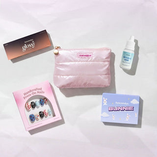 EyeCandys Travel Pack set with Glossy Ivory 1-Day Contacts, Pink Puffer Pouch, Press-On Nails, Dream Lens Drops, and Colored Contact Lens Pair
