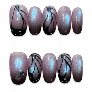 The Wing Woman Press-On Nails by EyeCandys feature a purple ombre base with blue shimmer, black abstract lines, white dots, blue rhinestones, and a silver butterfly accent—creating the perfect fairycore look.