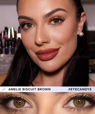 A woman with warm brown eyes, winged eyeliner, defined brows, and matte terracotta lipstick smiles at the camera. A close-up below highlights her EyeCandys Amelie Biscuit Brown lenses and detailed eye makeup.