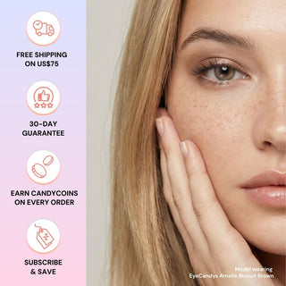 Close-up of a woman with smooth skin and light brown eyes wearing EyeCandys Amelie Biscuit Brown lenses, touching her cheek. Enjoy free shipping over $75, 30-day guarantee, CandyCoins rewards, and subscribe & save perks.
