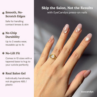 Close up hand showcasing EyeCandys Bloom n Fade press on nails with nude cat-eye shimmer and sheer pink glazed finish.