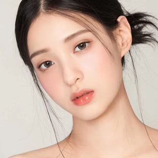 A young woman with fair skin and straight dark hair wears Gemhour Demeter 1-Day 13.0 Pebble Grey (10pk) contact lenses, looking at the camera against a plain light background.