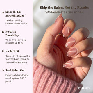 Hand wearing EyeCandys Grapefruit Soda press on nails featuring summer pink cat-eye nails with juicy translucent gradient look.