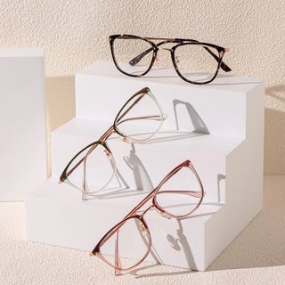 Three pairs of EyeCandys Posh Square unisex rectangular glasses in brown and pink are displayed on white geometric risers, casting subtle shadows on a light textured background.