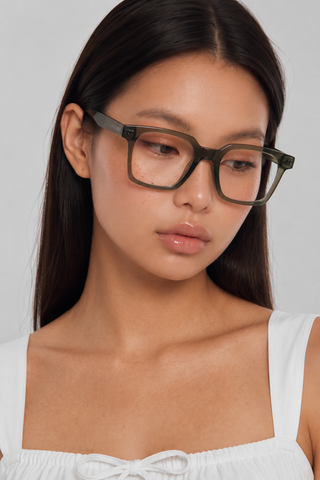 EyeCandys Hotshot Square Green clear lens glasses model shot featuring oversized green square frames with non-prescription clear lenses, trendy women's fashion eyewear, blue light style glasses for everyday wear, office outfits, minimalist fashion, and modern chic looks.