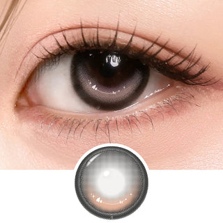 Close-up of eye with long lashes wearing i-Girl One Pick Dear One Brownie contact lens from EyeCandys, showing warm brown iris color and detailed lens design