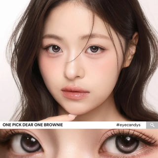 Close-up of model’s eyes wearing i-Girl One Pick Dear One Brownie contact lenses from EyeCandys, showing warm brown iris color, realistic highlights, weighted non-rotating design, and subtle eye-widening effect
