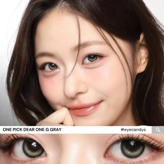 Close-up of model’s eyes wearing i-Girl One Pick Dear One Grey contact lenses from EyeCandys, showing smoky grey color, double-circle iris design, subtle eye-widening effect, and realistic dimensional highlights