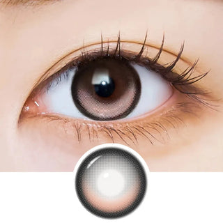 Close-up of an eye with long lashes wearing EyeCandys i-Sha Dekame Kiss Me Milky Choco brown colored contact lenses