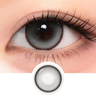 A close-up of an eye wearing i-Sha One Pick Only One 1-Day Velvet Smoke Grey (10pk) contacts by i-Sha, showcasing the 3-tone gradient lens design. These daily disposables enhance and define the eye with a natural grey look.