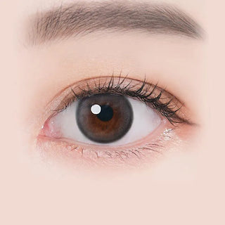 Macro shot of an eye wearing the i-Sha Ariel Grey prescription colour contact lens, showing the multi-colored detail and natural effect on dark brown eyes.