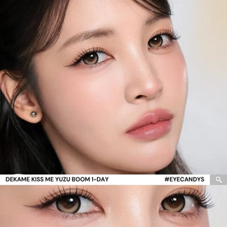 Model with natural makeup and long lashes wearing EyeCandys i-Sha Dekame Kiss Me 1-Day Yuzu Boom Brown colored contact lenses, close-up of brown eyes with natural enhancement