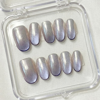 Short oval press on nails EyeCandys Lavendroid with holographic chrome base, cat eye shimmer, and deep violet gradient tips.