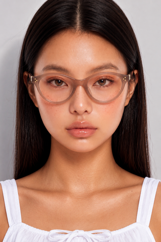 EyeCandys Loretta optical reading glasses model shot featuring chic prescription-ready frames with clear lenses, fashionable women's eyewear for reading, computer use, office wear, blue light style, everyday comfort, and timeless modern fashion.