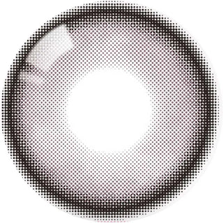 A single Olola Meow Natural Angora Pink contact lens viewed from above features a translucent center and dotted brown-black ring, designed to enhance your iris for a subtle pop—ideal for those wanting the soft look of Olola's bestselling lenses.