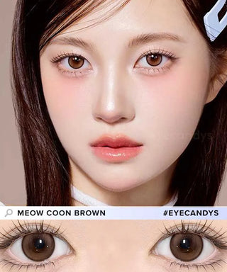 Close-up of a woman with fair skin, straight brown hair, and big brown eyes wearing natural makeup. She wears Olola Meow Natural Coon Brown contacts by Olola, shown below and labeled #EYECANDYS.