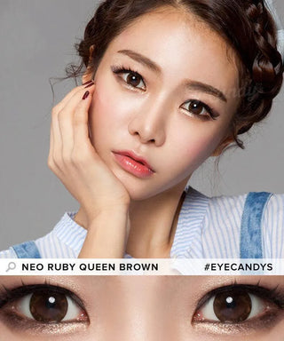 A woman with flawless skin and long lashes poses, wearing NEO Vision Ruby Queen Brown Custom Toric contacts for astigmatism. A close-up highlights the brown lenses. Text reads “NEO Vision Ruby Queen Brown #EYECANDYS.”.