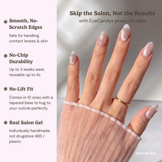 Hand displaying EyeCandys Ballet Slippers press on nails with pearl accents, subtle French tips, and clean girl balletcore aesthetic.