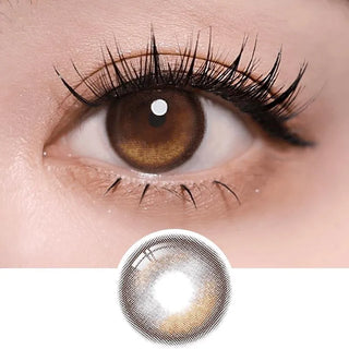 Macro shot of an eye wearing the i-Sha Oriana Edge Plus Shade Brown prescription colour contact lens, showing the multi-colored detail and natural effect on dark brown eyes, with clean eye makeup. At the bottom is the pattern of the colored lens design, showing the dotted detail and pigmentation.