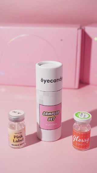 Unboxing EyeCandys contact lens sampler set with prescription colored contact lenses in eco-friendly cardboard tube and pink gift box – discover premium color contact lenses in every style.